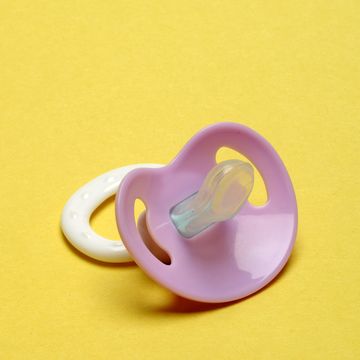 Dummy Pacifier on Yellow Background