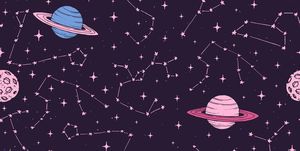 Hand drawn seamless pattern with zodiac constellations, planets and moons in pink pastel colors on the dark background. Cosmic backdrop.