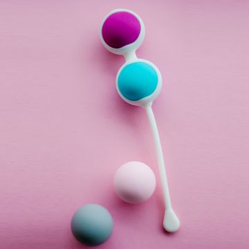 Color Kegel balls, Geisha balls in pink background